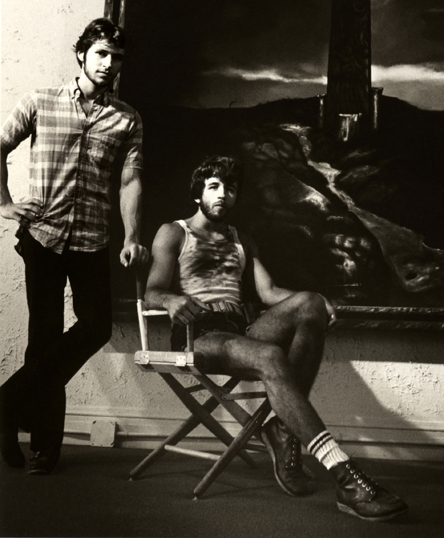 Artist G. Mark Mulleian with model Ron Raz, seated before the crucifixion painting "Spring Crossing".